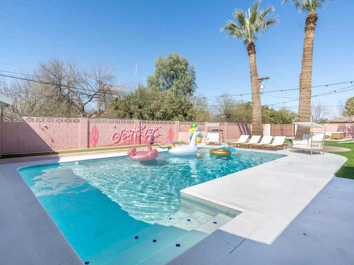 The backyard sits on a double lot, so Aguirre had ample space to create fun for guests who stay at the Femme House. She continued the pink theme in the space, painting the brick wall surrounding the yard pink.