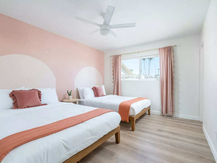 Aguirre continued the pink color scheme in the three bedrooms, which sleep 12. She also painted archways onto the walls in lieu of headboards.