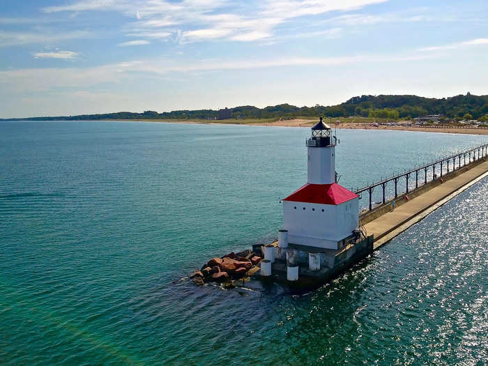 Michigan City Beach in Indiana is home to 2 miles of beach, a lighthouse, and peaceful waters.