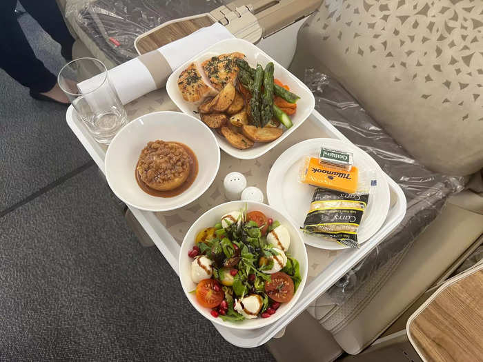 Premium economy passengers will also be treated to more meal options, including things like a grilled chicken fillet and bocconcini salad for lunch...