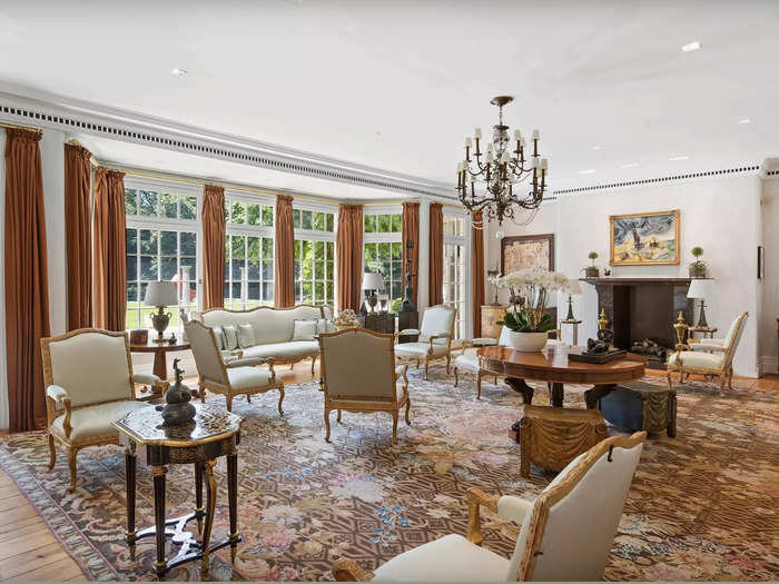 This formal sitting room features a fireplace, one of eight throughout the home and its cabanas.