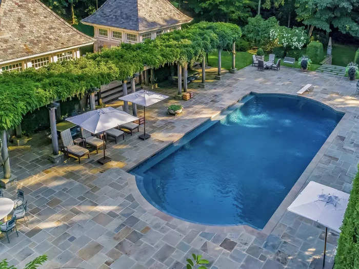 The second pool, which is 70 feet by 30 feet, is next to two more cabanas. One has a full catering kitchen, and the other has two bathrooms, dressing rooms, and an outdoor shower.