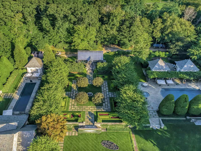 Aerial photos show the well-manicured gardens and the home