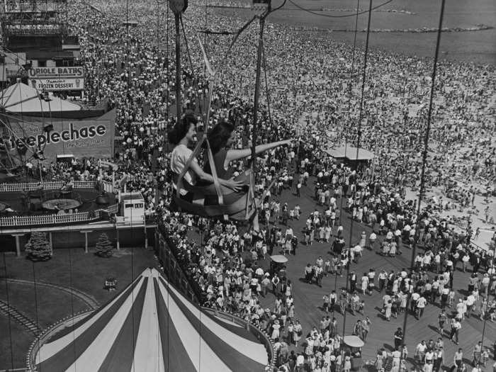 From the top of the Ferris wheel, these women caught a scenic view of a packed Coney Island on a summer day.