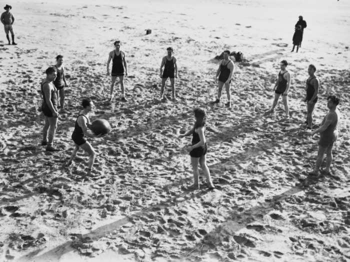 Others enjoyed playing ball games on the sand, like this group of friends in 1923.
