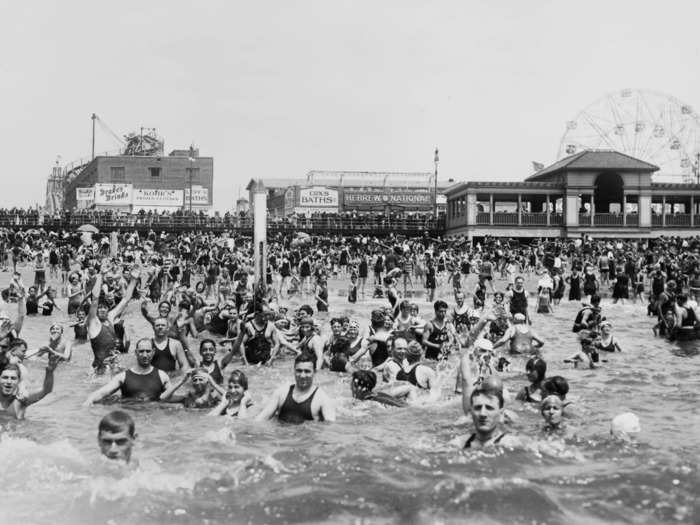 In 1920, these happy beachgoers went for a swim to beat the summer heat.