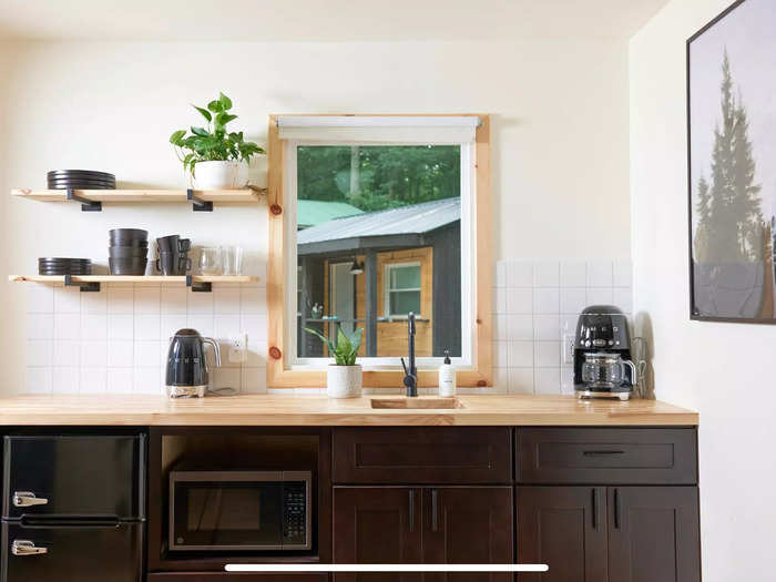 The kitchen area of a newly renovated motel unit