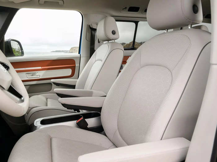 Up front, drivers get seats with armrests…