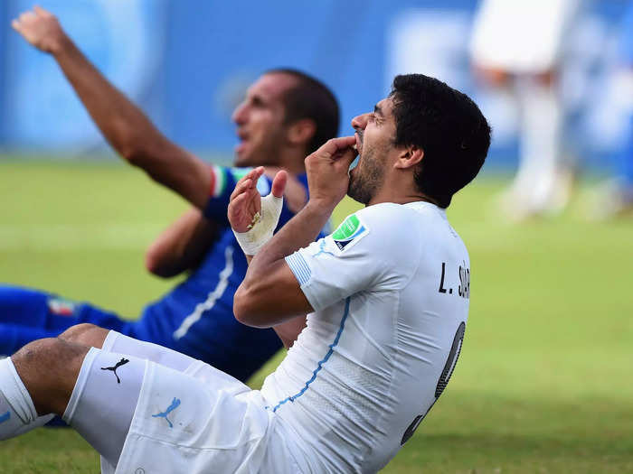 Luis Suarez takes a bite(s).