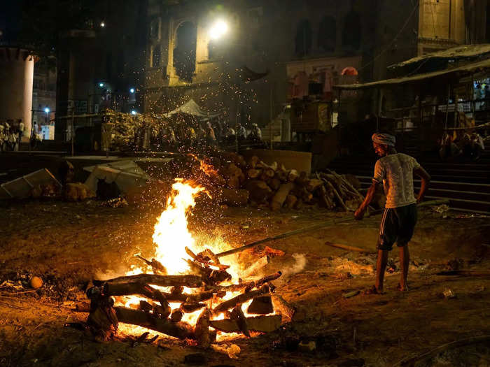 The Doms, a group belonging to a Hindu caste, earn their living by running the cremation pyres and maintaining the source fire that is used to light all of the pyres.