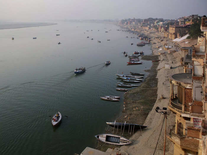 The city sprawls out along the banks of the Ganges River. According to one travel guide, while the Ganges usually flows east and west, it flows north and south so that it can "touch" Varanasi.