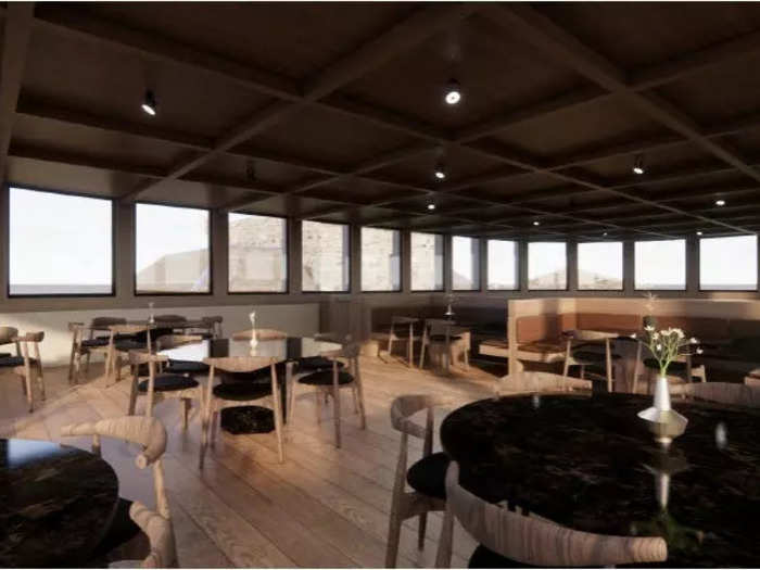 An elevated dining room will have views of the land and sea.