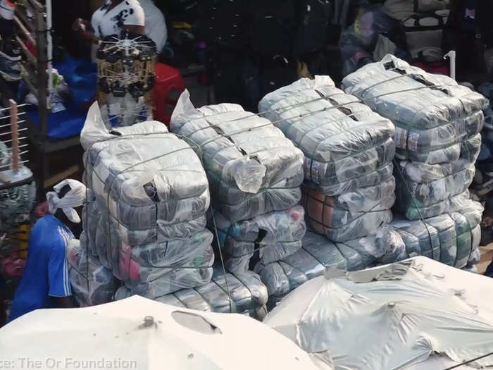 Shipping containers of tightly-packed, 125-pound bales arrive in the ports of Accra for distribution. Retailers buy the bales from anywhere between $100 to $300 without knowing its contents.