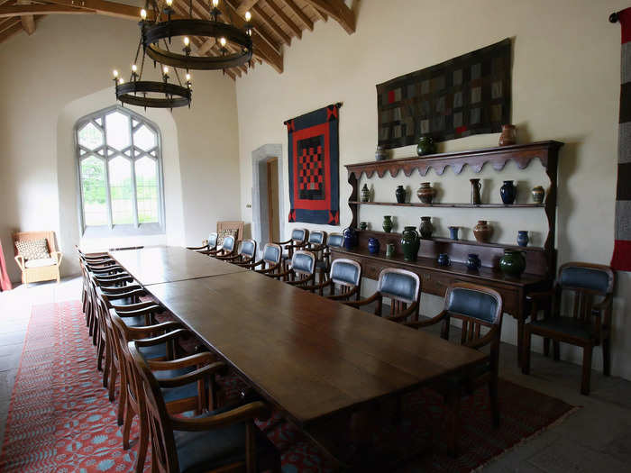 The dining hall, which was transformed from a cattle shed, features a large rug with a pattern based on an 18th-century Welsh blanket design.