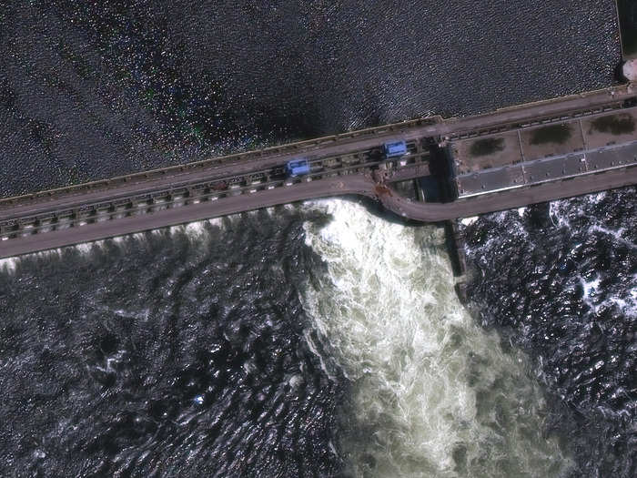 Before the break, you can see a curved chunk of the dam still intact in this satellite image taken on May 28.