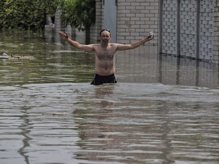 Residents downstream from the dam were already wading through floodwaters on Tuesday.