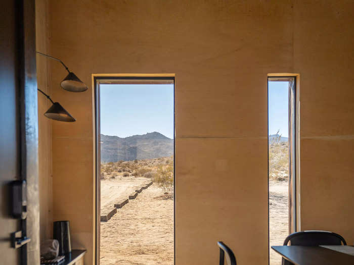 The living space in the main cabin has lots of windows that also provide views of the desert.