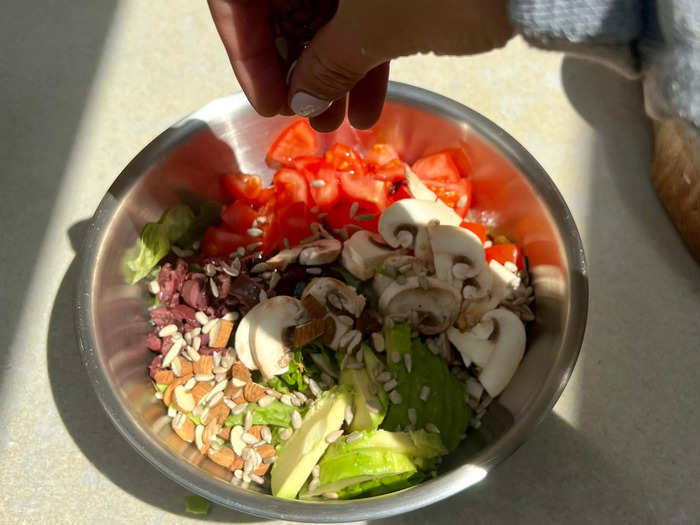 Once I added in slices of avocado, I added the final crunchy toppings.