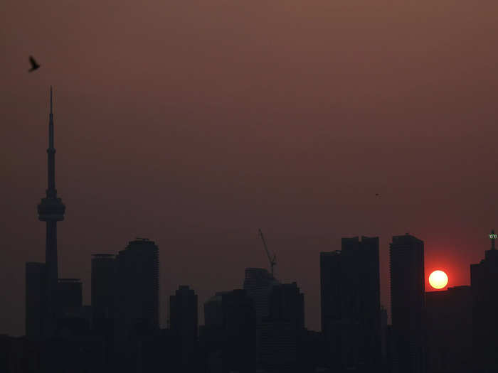 The smoke hit Toronto, Canada, this week too, with it giving the sun a deep, red glow.