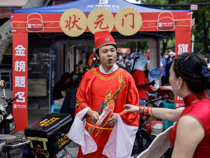 The concept of Gao Kao resembles the imperial exams from ancient China, through which anyone could become an official based on their results. This man in Wuhan is dressed up as China