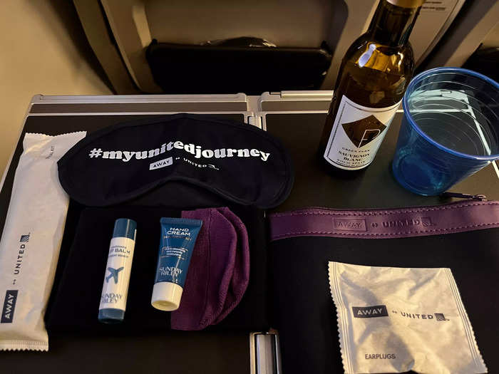 Another major difference was the amenities. In premium plus, my flight came with this adorable toiletry bag that included a toothbrush, chapstick, lotion, socks, earplugs, and a sleep mask.