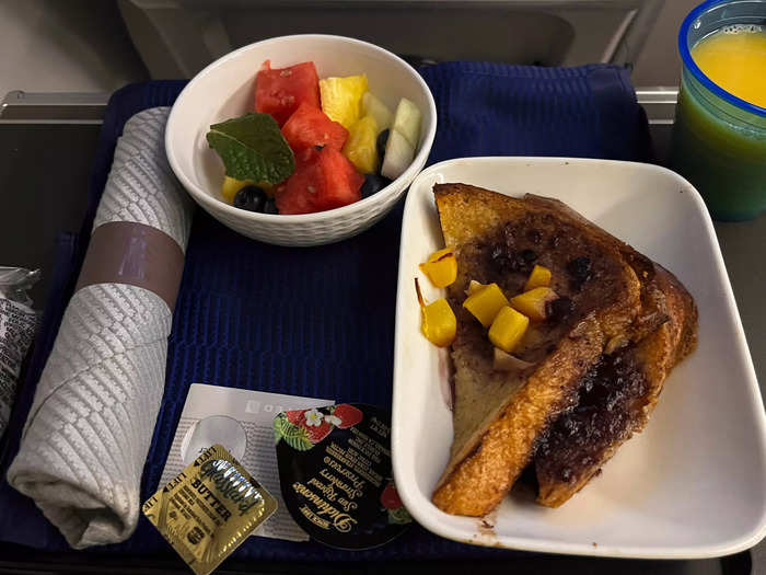 I was thrilled that before landing in London, I was also served a hot breakfast. I thought this meal was slightly better — though the French toast was a bit soggy. Still, the fresh fruit was delicious.