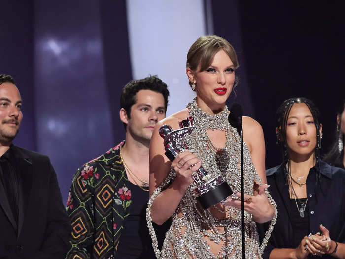 The metallic dress Taylor Swift wore to the 2022 VMAs drew comparisons to the silver gown she wore 13 years prior when her acceptance speech was infamously interrupted by Ye.