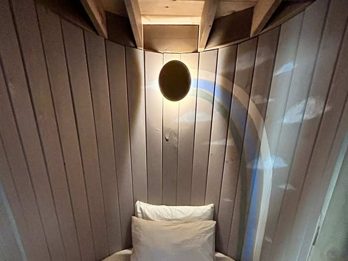 The first floor also has a small, round bed tucked into a nook. I