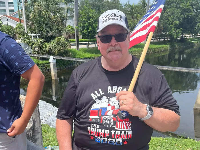 Demonstrators waved American flags.