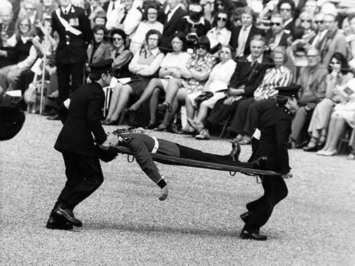 A soldier was carried away on a stretcher after he fainted during the ceremony in 1974.