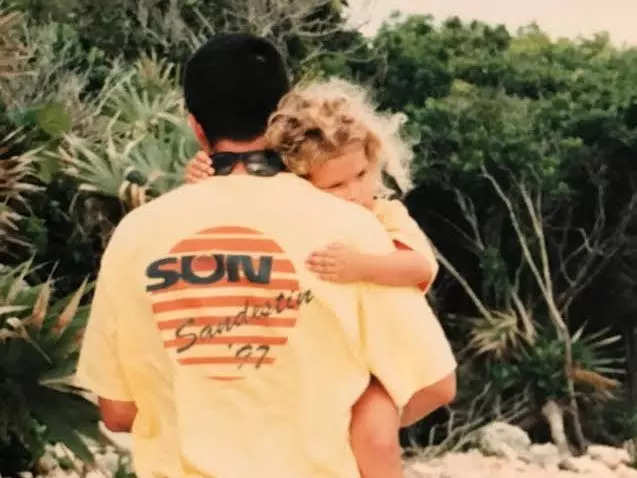 Dad carrying daughter