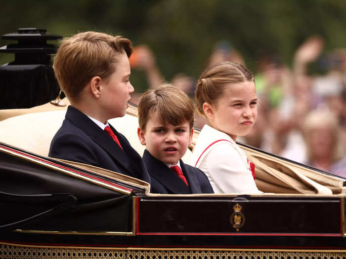 Prince Louis appeared unimpressed as he took in the crowds that gathered outside Buckingham Palace.