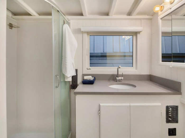 The houseboat has a bathroom with a shower.