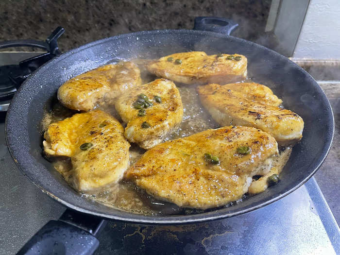 After removing the chicken from the pan, add the rest of the ingredients to create the sauce.