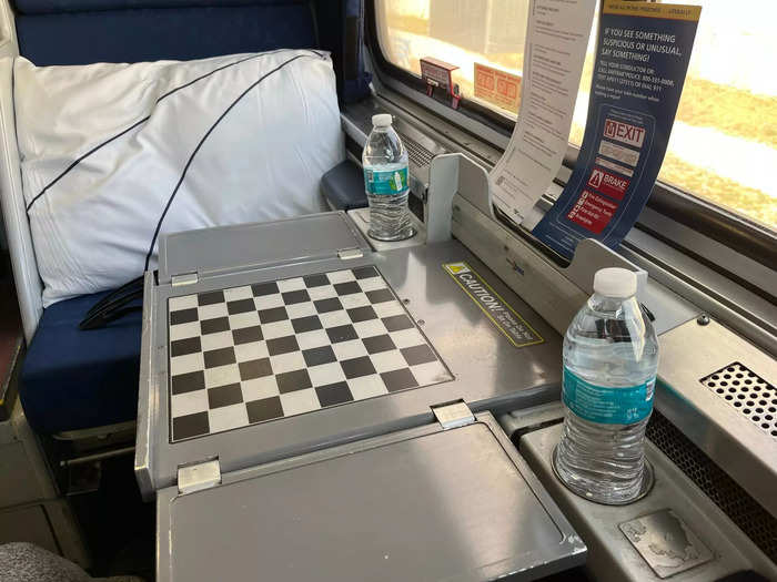 The foldable table gave us ample room to work, game, and dine. In the cupholders, we stored the complimentary water bottles we received upon boarding.