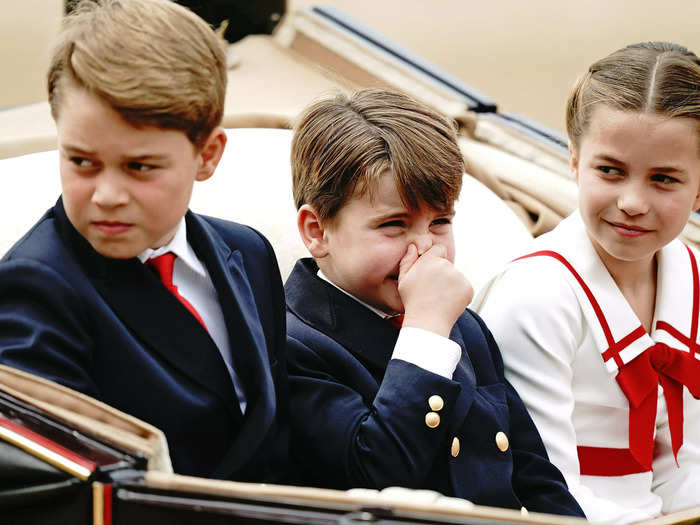 He laughed with his siblings, holding his nose.