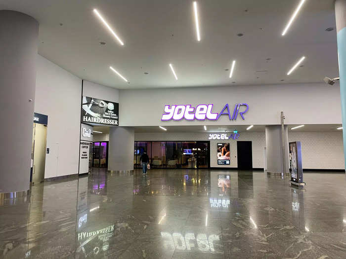 The Yotelair is perched at the end of a wide hallway that branches off from all of these airside luxury shops, dining venues, and gift stores.