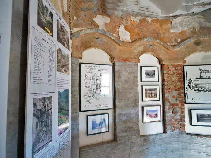 Drawings and documents about the castle and the Bannerman family are framed on the building