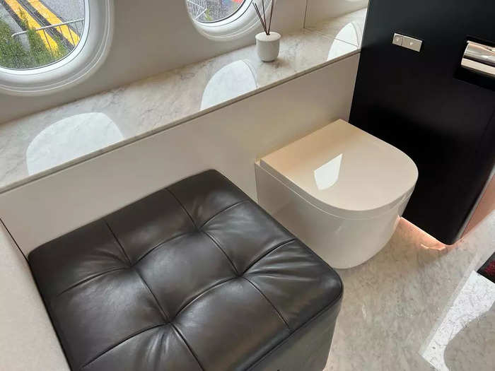 The marble floor adds to the luxury, with a toilet that would look more at home in a hotel than a plane.