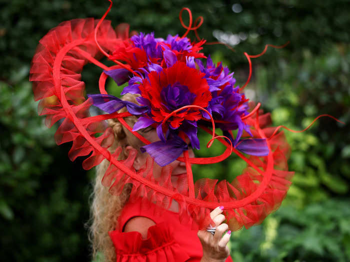 One hat featured boldly colored flowers and a hoop covered in tulle.