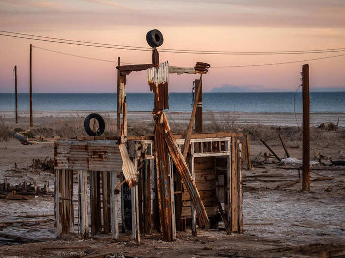 Around 230 people still live in town. In the early 2010s, they started sharing it with groups of creatives who showed up to Bombay Beach to produce art there.