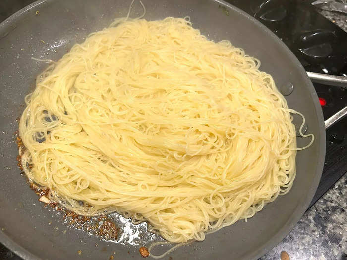 Once my pasta was ready, I drained it and returned it to the pan where I had cooked the shrimp.