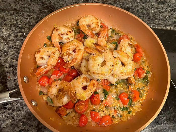 I drizzled some olive oil and sprinkled lemon zest over the shrimp, then added them to my pan with the sauce.