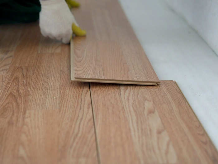 Mixed flooring materials and synthetic wood finishes often clash.