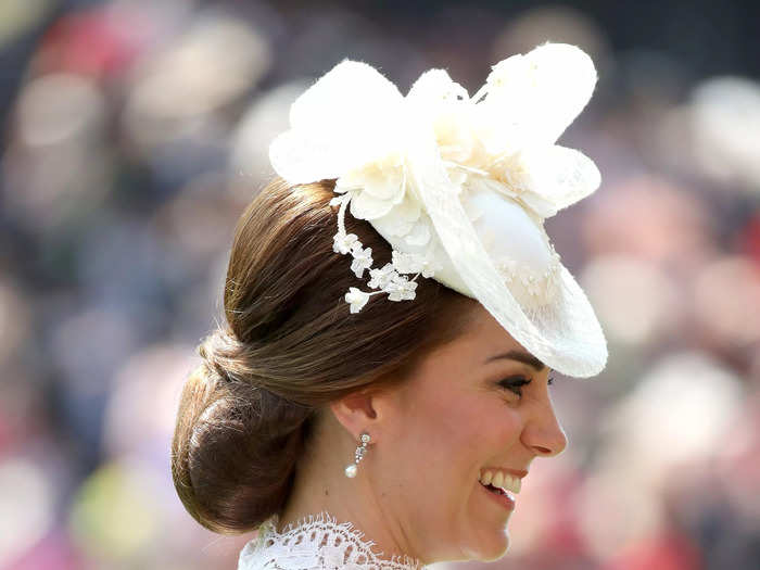 Her custom white hat was also similar to the 2016 design, although it had additional, delicate floral embellishments.