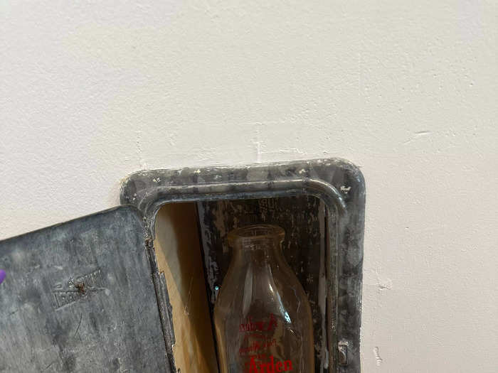 When renovating the home, the couple found an old milk door, where milkmen would make deliveries years ago.