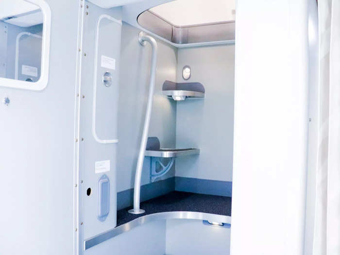 Some flight attendants in the rest area will be resting just feet above where passengers sit in the economy class cabin.