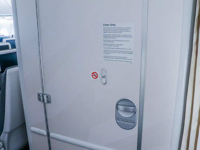 A locked door that says “crew only” in capital letters ensures that wandering passengers can’t unknowingly find the space while looking for the lavatory.