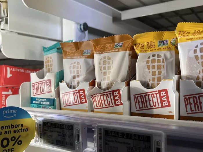 Moving on to dairy, I searched the refrigerators for a specific protein bar I knew was available at Whole Foods. I eventually found the Perfect Bar flavor I wanted and headed to the hot foods section.