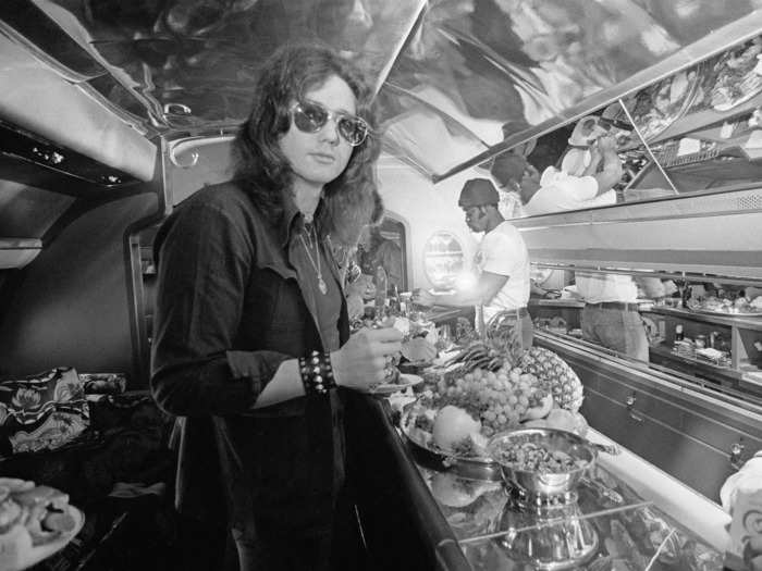 Described by Gruen as a "flying tour bus," the jet had myriad spaces to sit back and relax, like a long brass bar…